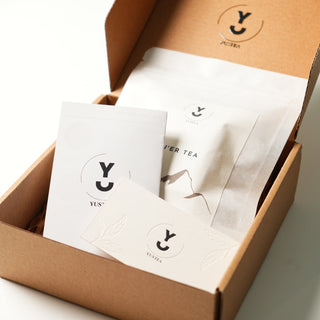 Tea packaging with white cards and brown box